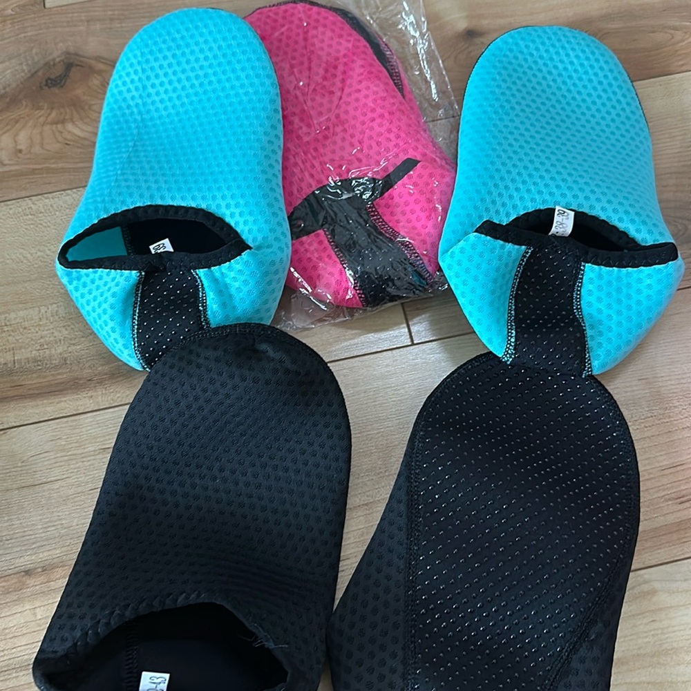 Turquoise and pink water shoes. Soft sole fits 6.5-7.5. Black fits 8-9 women’s